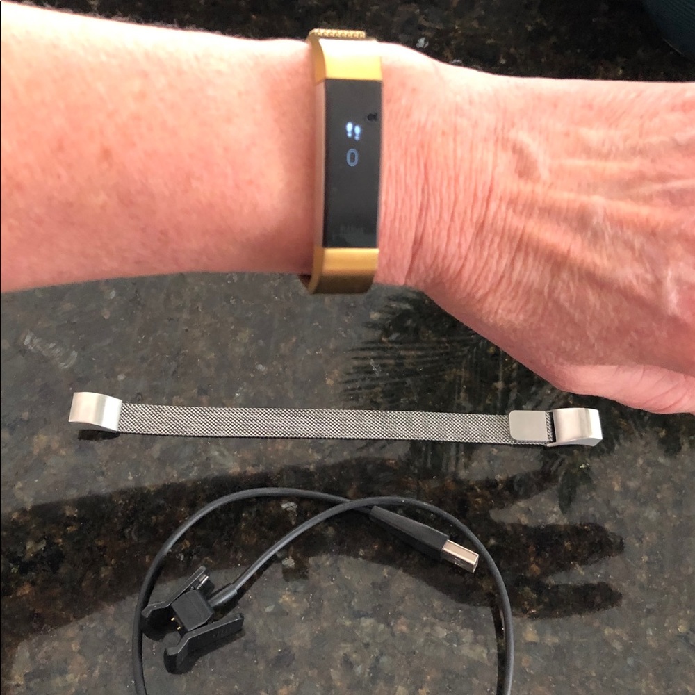 Alta FitBit with gold and silver bands.